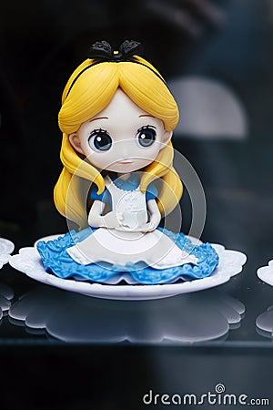 Valence, France - August 19, 2020 - Plastic figurine of Disney Princess Alice in Wonderland Editorial Stock Photo