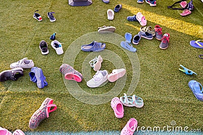 Valencia, Spain - August 22, 2019: Many children`s sandals lying on the floor Editorial Stock Photo