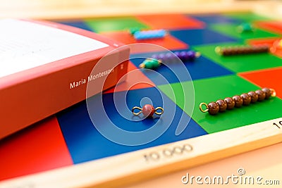 Valencia, spain - february 10, 2022: Spine of a book about Maria Montessori on a board of educational teaching material Editorial Stock Photo