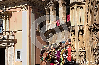 Image of the Giants of the Corpus Christi cavalcade next to the Puerta de los ApÃ³stoles of the Cathedral of Valencia Editorial Stock Photo