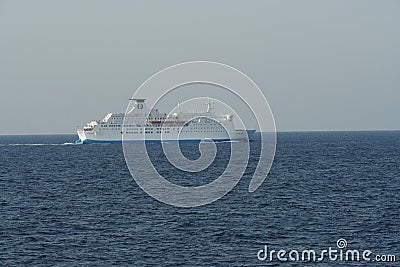 White Passenger, Ro-Ro, Cargo Ship Moby Zaza leaving the port of Valencia and sailing through blue Mediterranean Sea. Editorial Stock Photo