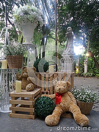 Valentine Bear sitting and lean on flower basket Stock Photo