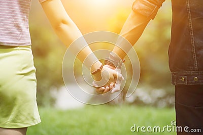 Valentine couples walk hand in hand along the aisles to see the beautiful scenery on the morning of Valentine`s Day and promise t Stock Photo