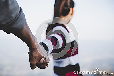Valentine couples walking hand in hand, promised to take care of each other Stock Photo
