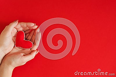 Valentine day gift handmade felt heart hands red Stock Photo