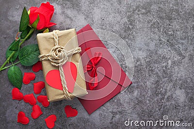 Valentine day gift, rose and envelope on table, top view Stock Photo