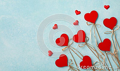 Valentine day greeting card or banner. Various red hearts on blue background top view. Flat lay style Stock Photo