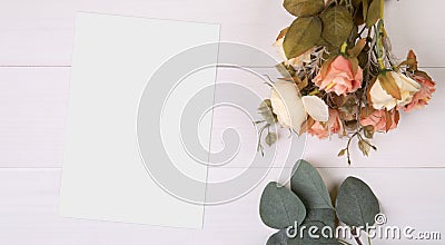 Valentine day, greeting card mockup and flower on wooden table, postcard blank and letter with romance on desk. Stock Photo