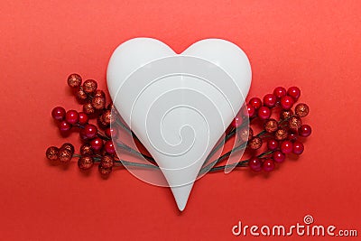 White hearts with red berries on red backgond Stock Photo