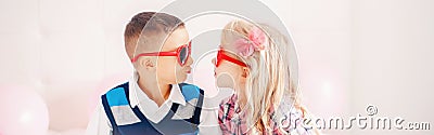 Valentine day holiday celebration. Web header banner for website. Two happy Caucasian cute funny children wearing heart shape Stock Photo