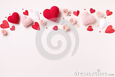 Valentine day or mother day festive composition with rose flowers and red pink hearts on pastel background top view Stock Photo