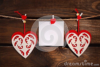 Valentine felt hearts and card on wooden background Stock Photo