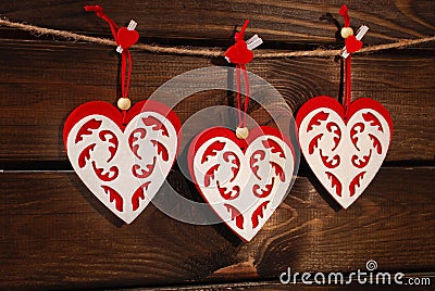 Valentine felt hearts on wooden background Stock Photo