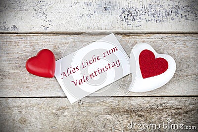 Valentine greeting card on wooden table with text Alles Liebe zum Valentinstag , written in German Stock Photo