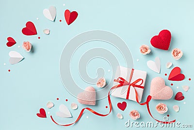 Valentine or mother day festive composition with gift or present box, rose flowers and red pink hearts Stock Photo