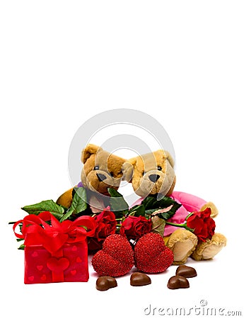 Valentine`s composition with two snugly teddy bears, roses, chocolaty candy, gift box and hearts on white background Stock Photo