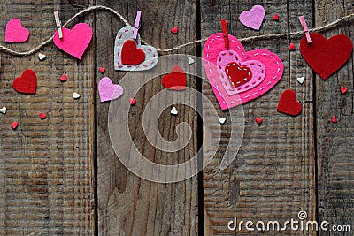 Valentine`s Day background with handmade felt hearts, clothespins. Valentine gift making, diy hobby. Romantic, love concept. Happ Stock Photo