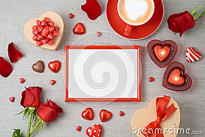 Valentine`s day background with photo frame, coffee cup, heart shape chocolate, candles and gift boxes Stock Photo