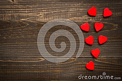 Valentine`s day background. Red hearts on the wooden desk Stock Photo