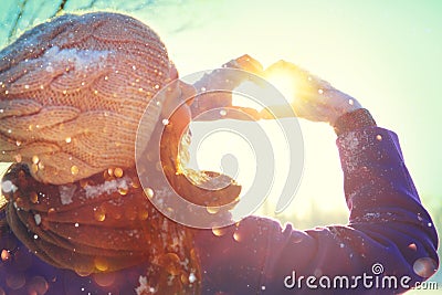 Valentine`s Day. Beauty joyful teenage model girl having fun in winter park Stock Photo