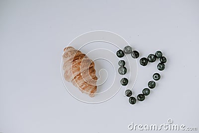 Valentine`s Day. Blueberry heart. Beautiful heart made of berries. Heart on a white background. Morning breakfast for valentine`s Stock Photo