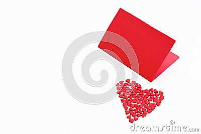 Valentine`s day card with a small red heart on a white background. Stock Photo