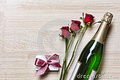 Valentine`s Day. Valentine`s Day. Champagne, gift box and red roses. Layout. Free space for text. Birthday, Wedding, Mother`s D Stock Photo