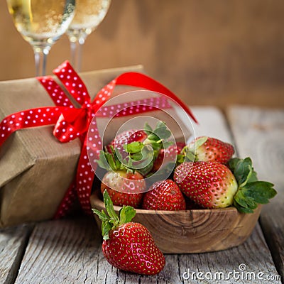 Valentine`s day concept - champagne, strawberry and present Stock Photo