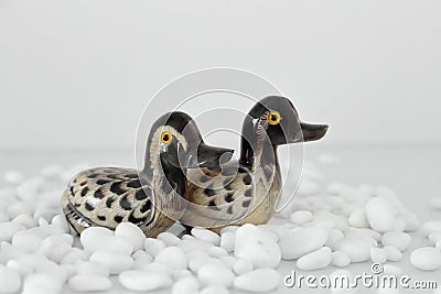 Valentine`s day concept. Couple in love, just married or honeymoon concept. Couple of stone mandarin ducks toy. Stock Photo