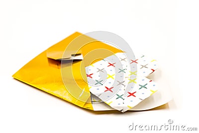 Golden origami envelope with white paper heart isolated on white Stock Photo