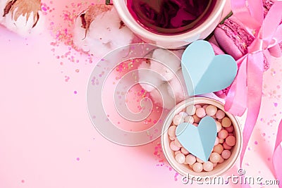 Valentine`s Day flat lay with hearts. Romantic pink pastel background. Macaroons with ribbon. Two hearts Stock Photo