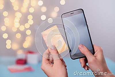 Valentine`s Day online shopping, searching on smartphone Stock Photo