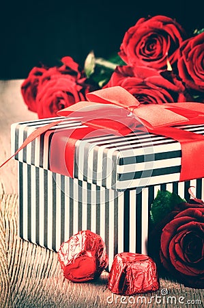 Valentine's setting with red roses and retro gift box Stock Photo