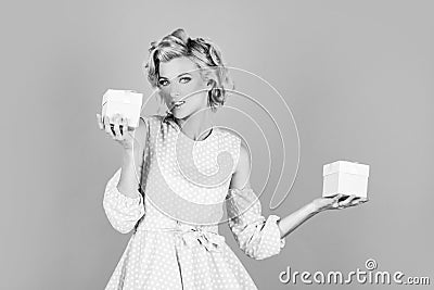 Valentines or birthday gifts. Portrait of sexy woman with gift. Holidays, celebration and womens day concept. Sensual Stock Photo