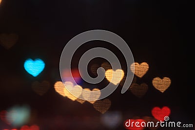 Valentines Colorful heart-shaped on black background lighting bokeh for decoration at night backdrop wallpaper blurred valentine Stock Photo