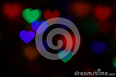 Valentines Colorful heart-shaped bokeh on black background lighting bokeh for decoration at night wallpaper valentine Stock Photo