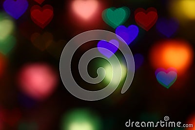 Valentines Colorful heart-shaped bokeh on black background lighting bokeh for decoration at night wallpaper valentine Stock Photo