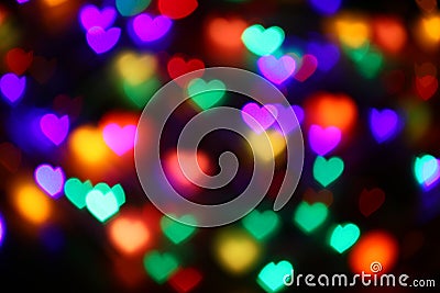 Valentines Colorful heart-shaped bokeh on black background lighting bokeh for decoration at night wallpaper valentine Stock Photo
