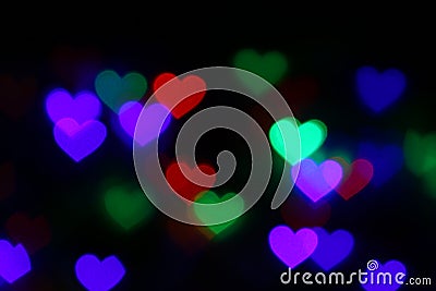 Valentines Colorful heart-shaped bokeh on black background lighting bokeh for decoration at night wallpaper valentine Stock Photo