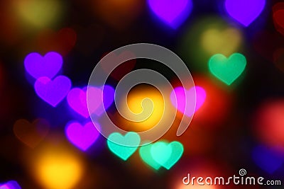 Valentines Colorful heart-shaped bokeh on black background lighting bokeh for decoration at night wallpaper valentine Stock Photo