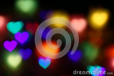 Valentines Colorful heart-shaped bokeh on black background lighting bokeh for decoration at night wallpaper valentine Stock Photo