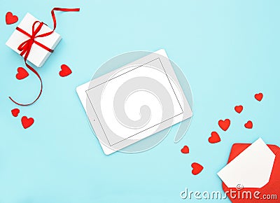 Valentines Day background Tablet gift box red hearts decoration Stock Photo