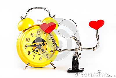 .Valentines Day background with tool third hand holding hearts and clock on white Stock Photo