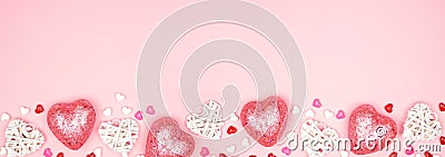 Valentines Day banner with long border of pink and white heart decorations against a pink background with copy space Stock Photo