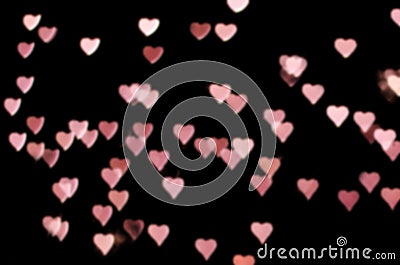 Valentines day bokeh overlay background. Pink hearts on the black background. romantic, festive atmosphere Stock Photo