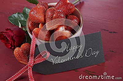 Valentines Day bowl of luscious heart shape red strawberries Stock Photo