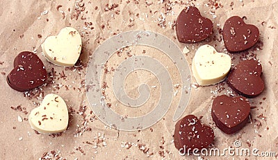 Valentines day, chocolate dark and white hearts on crumpled kraft paper Stock Photo