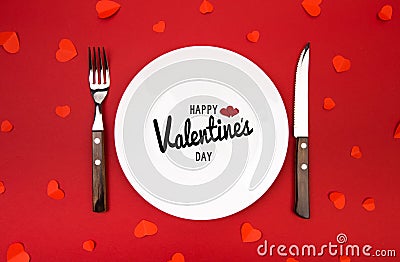 Valentines day dinner with table place decorated with hearts on red background. View from above. - Image Stock Photo