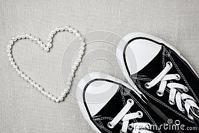 Valentines day flat lay banner. Chucks and pearls female concept. Stock Photo