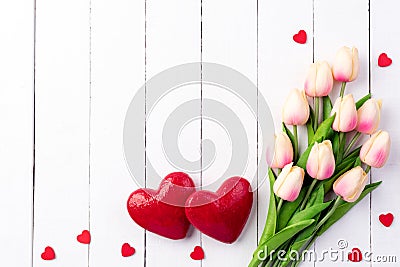 Valentines day and love concept. Two handmade red hearts with tulips Stock Photo